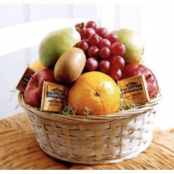 BASKET WITH TEA AND FRUITS