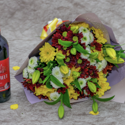 A MIXED BOUQUET OF FRESH COLORED FLOWERS WITH A WINE ! 